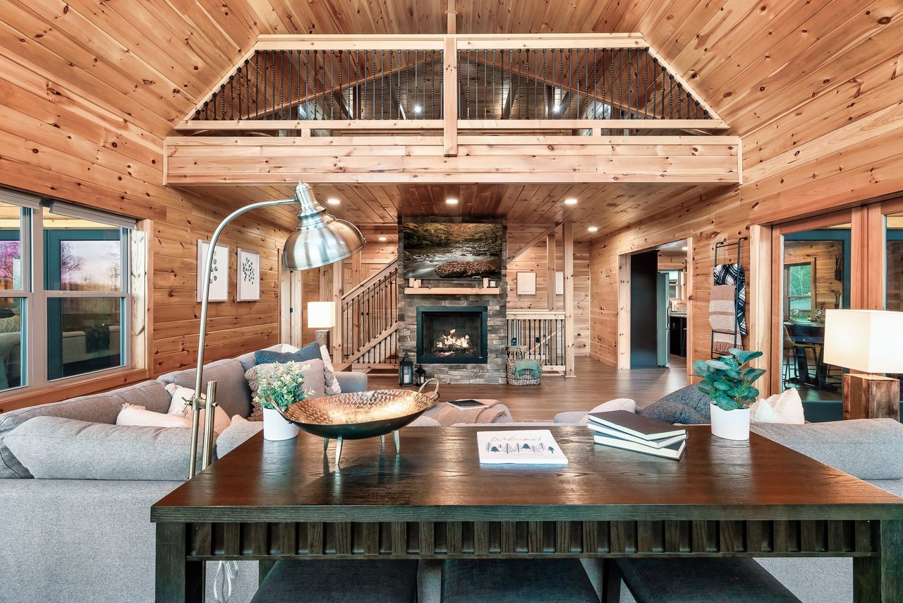 Living room: comfy seating, TV, gas fireplace, & sleeper sofa!