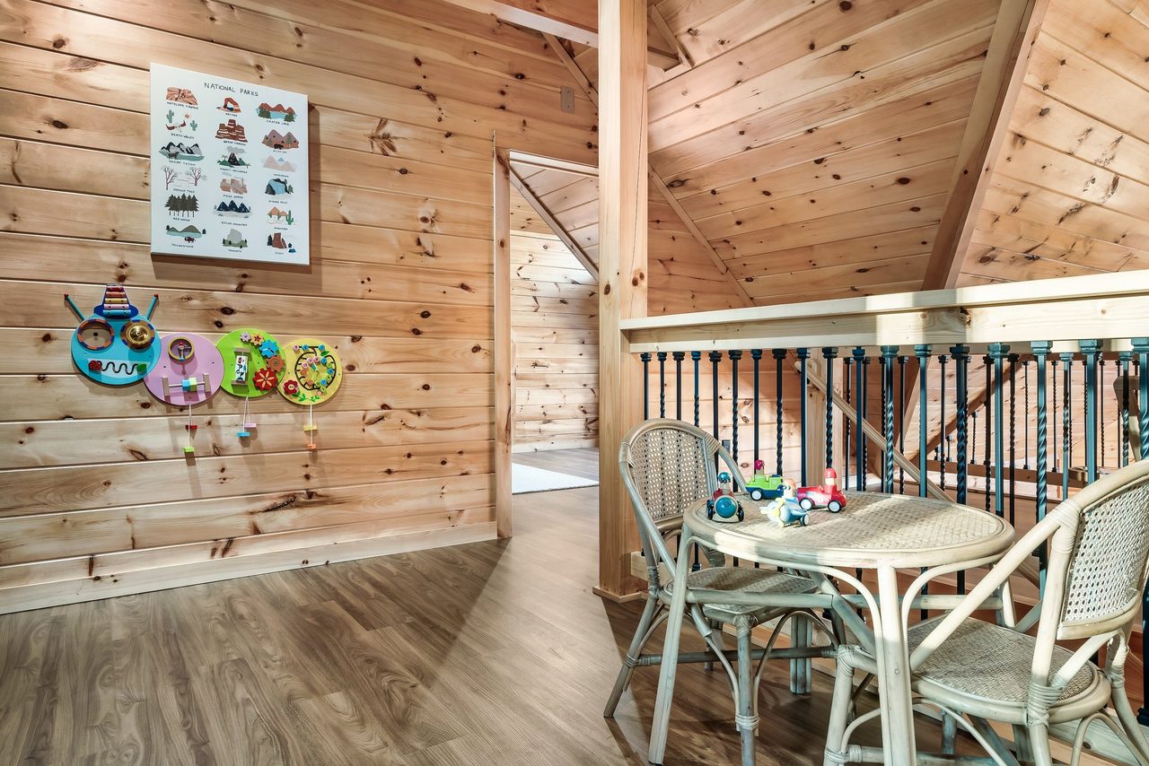 Upper level loft with 2 twin bunks and kids table