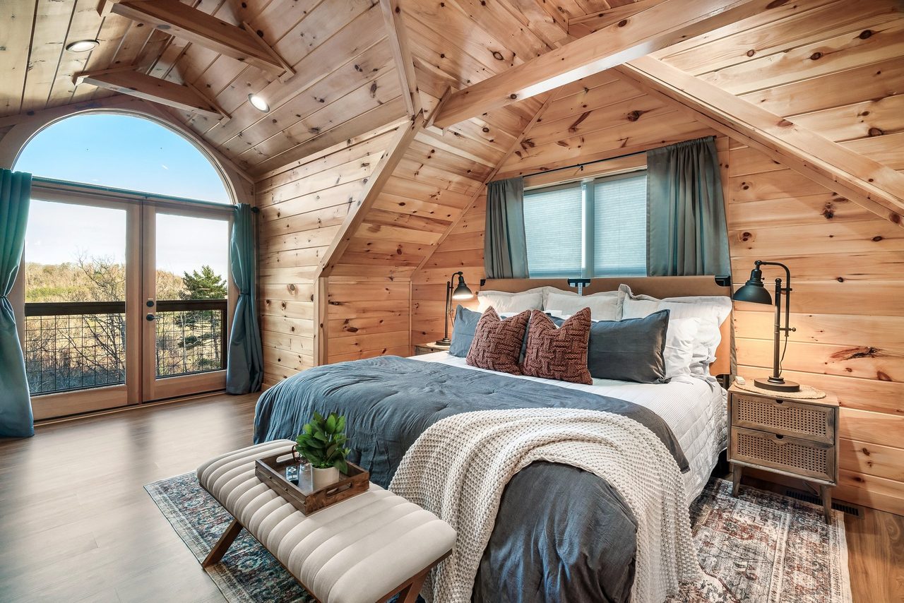 Bed 2: upper level, king, balcony, TV, & ensuite full bath
